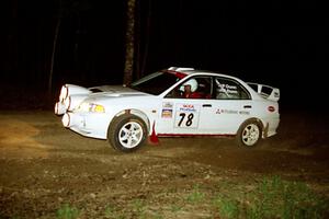 Paul Dunn / Rebecca Dunn head uphill at the crossroads hairpin in their Mitsubishi Lancer Evo IV.