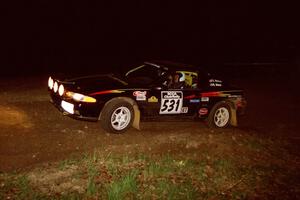 Steve Nielsen / Garrett Sturzl head uphill at the crossroads hairpin in their Plymoth Laser.