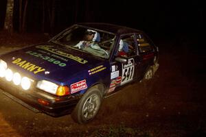 Darek Bosek / Piotr Modrzejewski head uphill at the crossroads hairpin in their Mazda 323GTX.