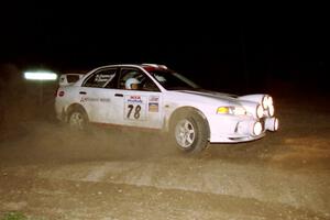 Paul Dunn / Rebecca Dunn drift their Mitsubishi Lancer Evo IV through the crossroads on the final stage of the rally.