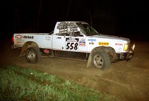 Jim Cox / Kaari Cox limp their Chevy S-10 Pickup heads through the crossroads after rolling midway through the event.