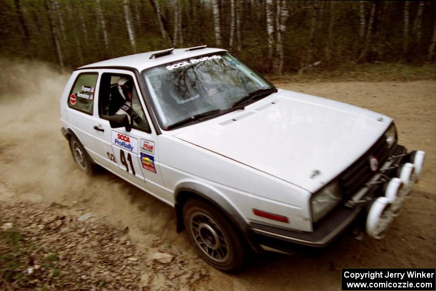 Art Burmeister / Rob Dupree drift their VW GTI through a 90-right on Indian Creek Rd., SS1.