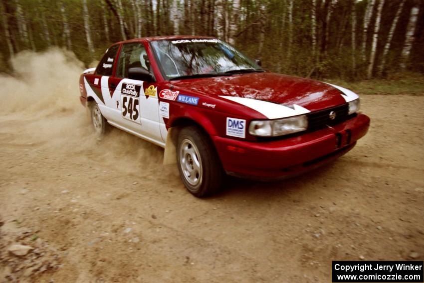 Eric Seppanen / Jake Himes drift through a 90-right on Indian Creek Rd., SS1, in their Nissan Sentra SE-R.