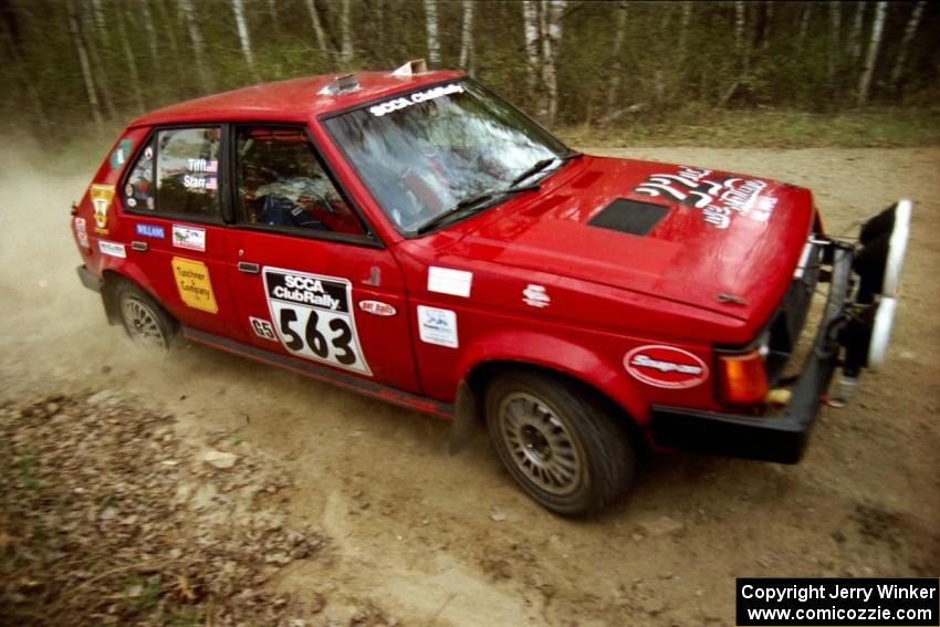 Gary Starr / Bill Tifft at a 90-right on Indian Creek Rd., SS1, in their Dodge Omni GLH Turbo.