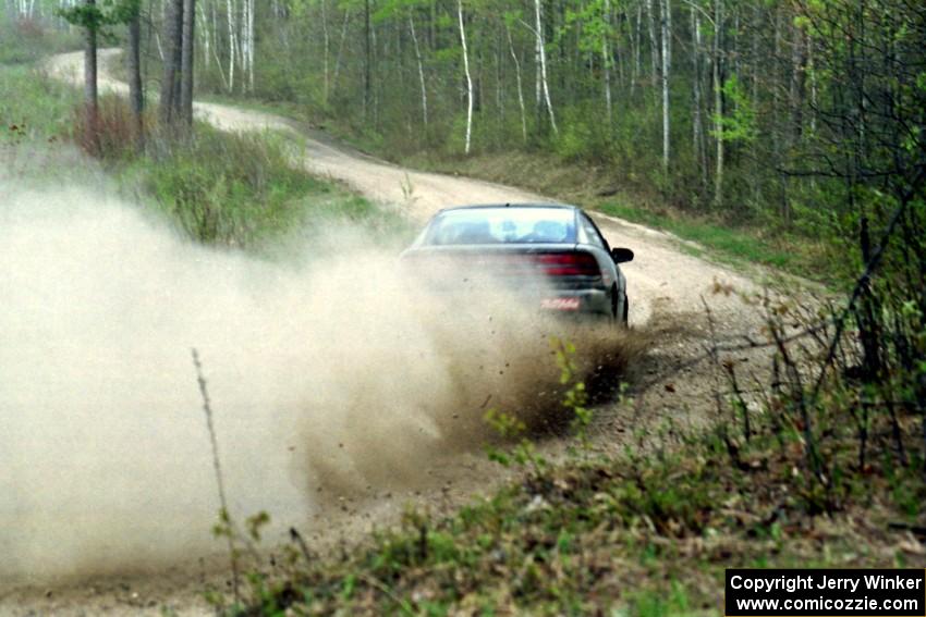 Dennis Martin / Chris Plante at speed in the Two Inlets State Forest in their Mitsubishi Eclipse GSX.