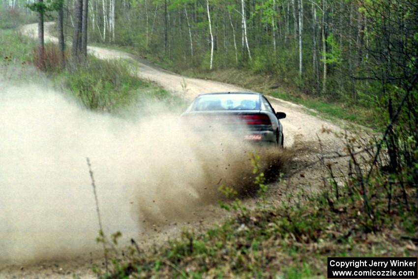 Dennis Martin / Chris Plante at speed in the Two Inlets State Forest in their Mitsubishi Eclipse GSX.