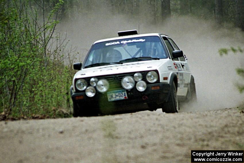 The Aaron Hatz / Brendan Higgins VW GTI at speed in the Two Inlets State Forest.