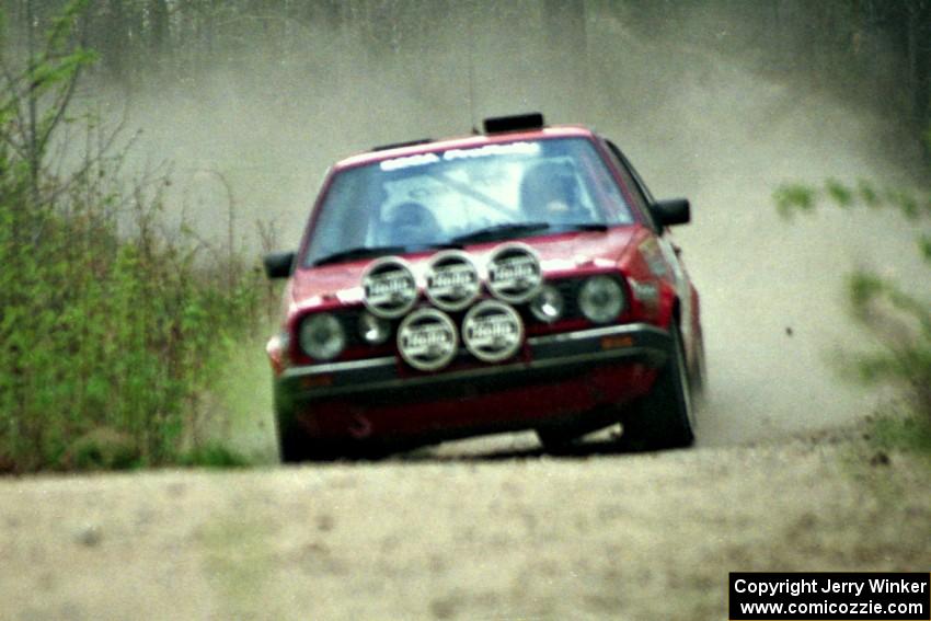 Al Kintigh / Diane Sargent at speed in the Two Inlets State Forest in their VW GTI.