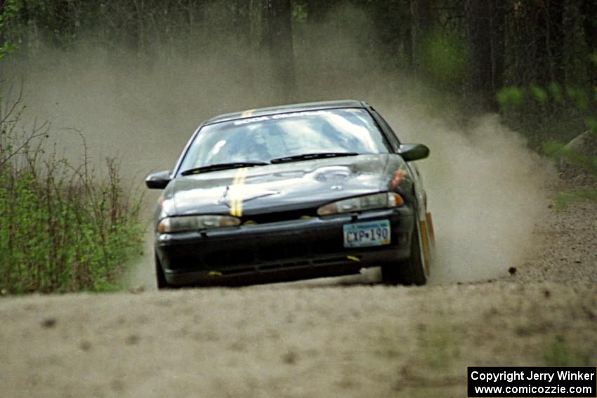 Steve Nielsen / Garrett Sturzl at speed in the Two Inlets State Forest in their Plymoth Laser.