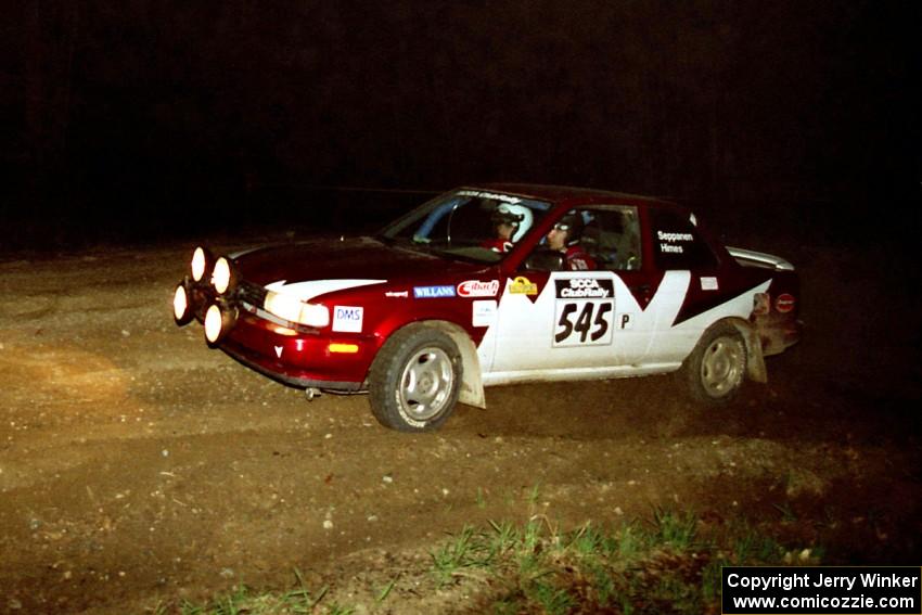 Eric Seppanen / Jake Himes head uphill at the crossroads hairpin in their Nissan Sentra SE-R.