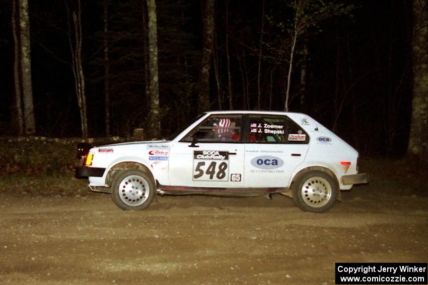 John Zoerner / John Shepski head uphill at the crossroads hairpin in their Dodge Omni GLH Turbo.