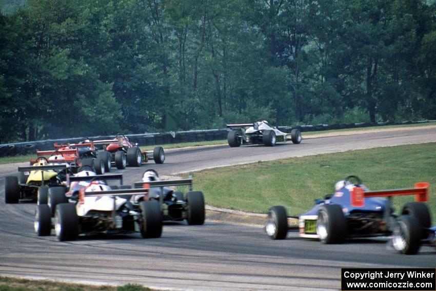 Elton Julian leads the field through turn one.