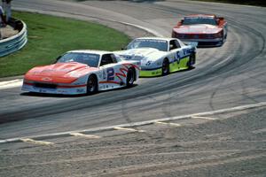 Deborah Gregg's Chevy Camaro, Randy Ruhlman's Chevy Camaro and Michael Dingman's Ford Mustang