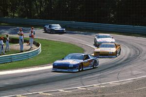 Jack Baldwin's Chevy Camaro, Scott Sharp's Chevy Camaro, Greg Pickett's Chevy Camaro and Ron Fellows' Ford Mustang