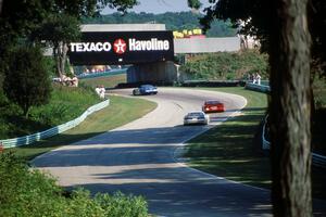 Jerry Simmons' Chevy Corvette ahead of Tommy Archer's Dodge Daytona and Jim Derhaag's Chevy Corvette