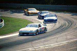 Greg Pickett's Chevy Camaro, Jack Baldwin's Chevy Camaro, Ron Fellows' Ford Mustang and Scott Sharp's Chevy Camaro