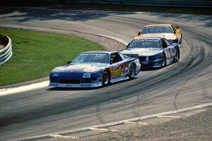 Jack Baldwin's Chevy Camaro, Ron Fellows' Ford Mustang and Scott Sharp's Chevy Camaro