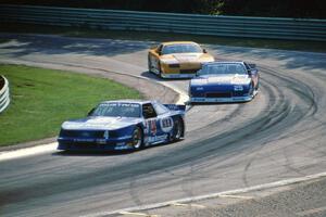 Ron Fellows' Ford Mustang, Jack Baldwin's Chevy Camaro and Scott Sharp's Chevy Camaro