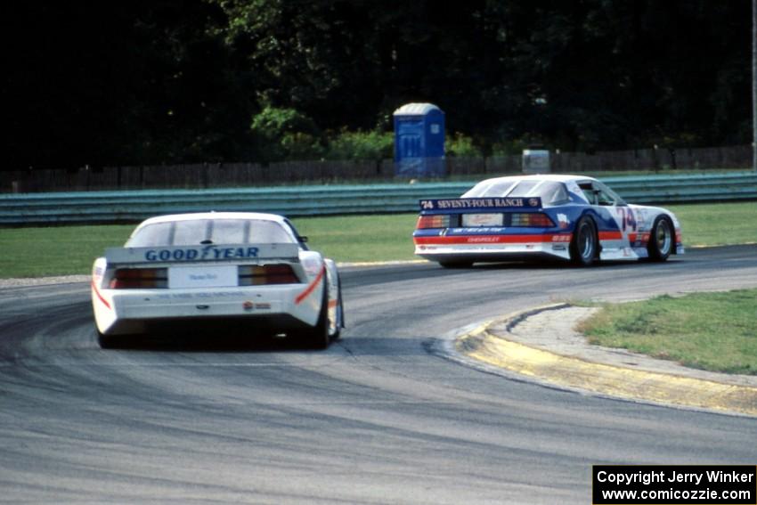 George Robinson's Chevy Camaro ahead of Deborah Gregg's Chevy Camaro