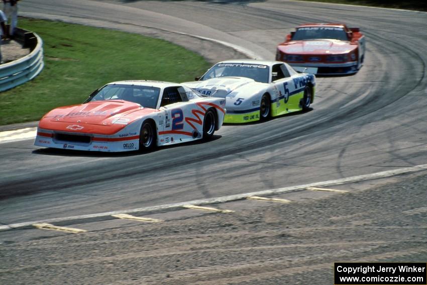 Deborah Gregg's Chevy Camaro, Randy Ruhlman's Chevy Camaro and Michael Dingman's Ford Mustang