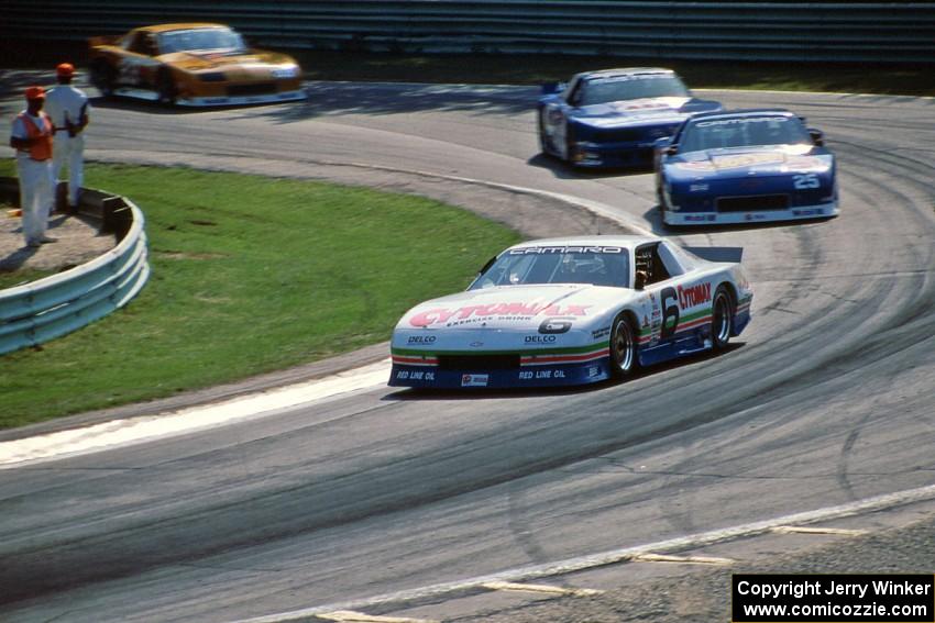 Greg Pickett's Chevy Camaro, Jack Baldwin's Chevy Camaro, Ron Fellows' Ford Mustang and Scott Sharp's Chevy Camaro