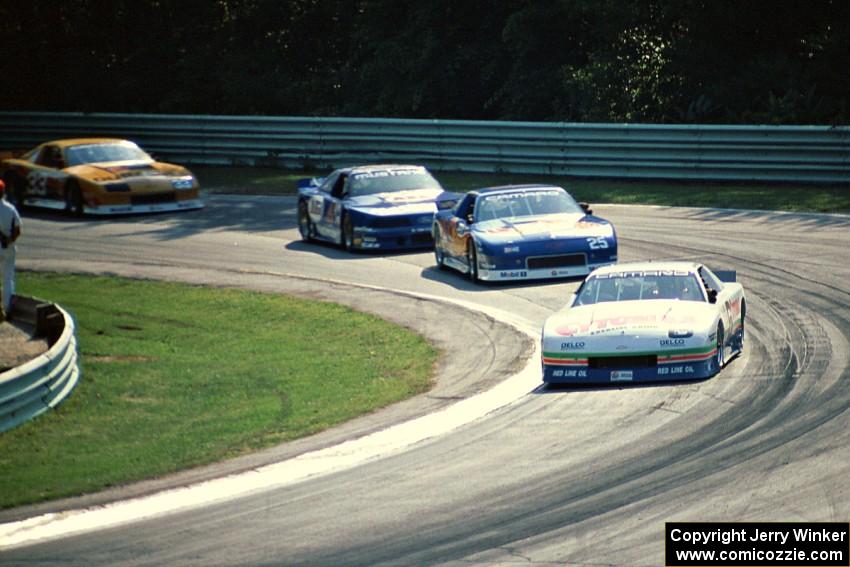 Greg Pickett's Chevy Camaro, Jack Baldwin's Chevy Camaro, Ron Fellows' Ford Mustang and Scott Sharp's Chevy Camaro