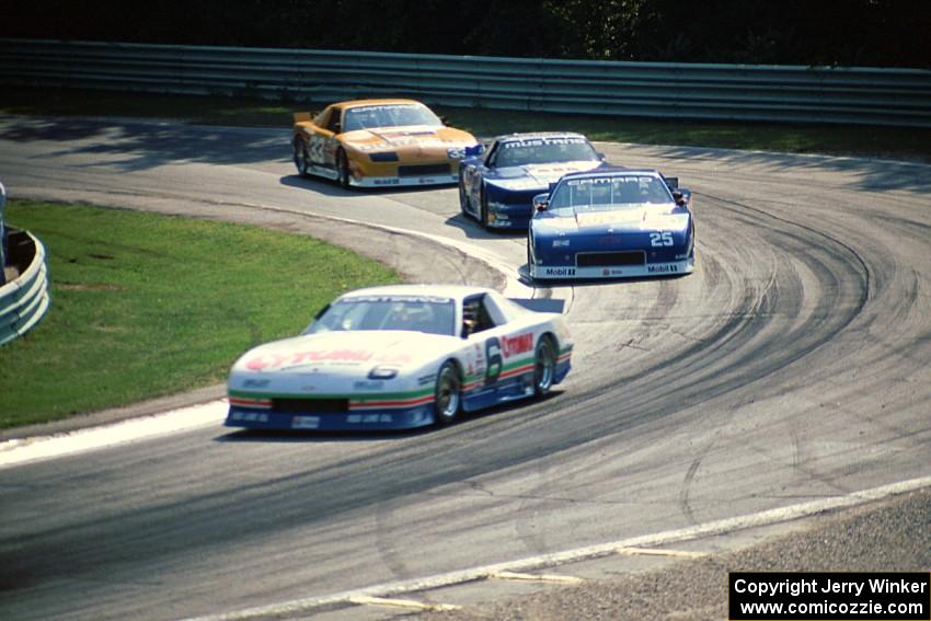 Greg Pickett's Chevy Camaro, Jack Baldwin's Chevy Camaro, Ron Fellows' Ford Mustang and Scott Sharp's Chevy Camaro