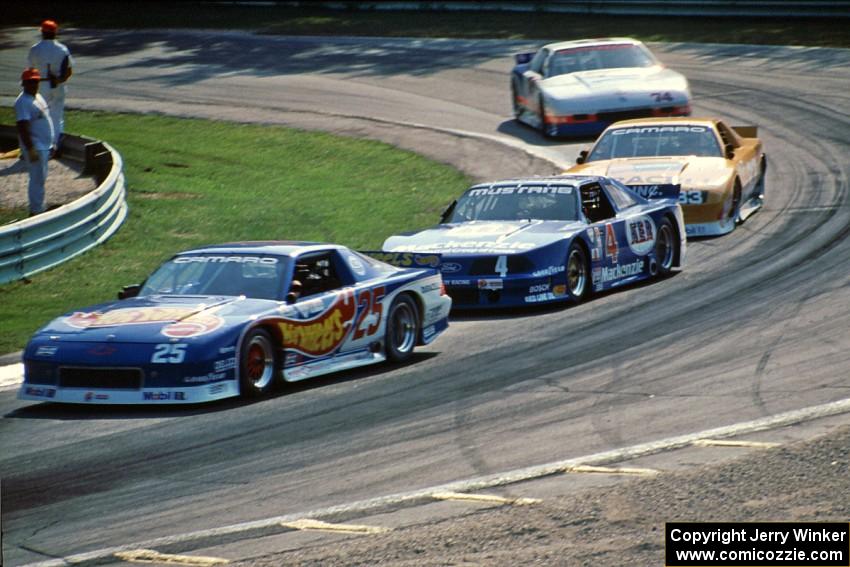 Jack Baldwin's Chevy Camaro, Ron Fellows' Ford Mustang, Scott Sharp's Chevy Camaro and George Robinson's Chevy Camaro