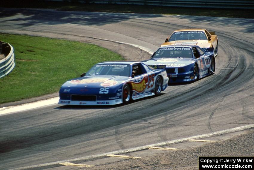 Jack Baldwin's Chevy Camaro, Ron Fellows' Ford Mustang and Scott Sharp's Chevy Camaro