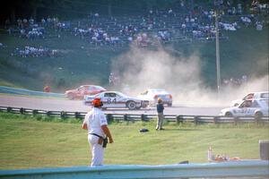 Chris Neville's Chevy Camaro is backwards after being hit between turns 5 and 6 on lap one.