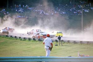 Chris Neville's Chevy Camaro is backwards after being hit between turns 5 and 6 on lap one.