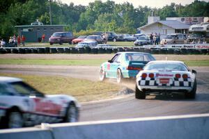 Boris Said III's Ford Saleen Mustang SC followed by Bill Cooper's and R.K. Smith's Chevy Corvettes