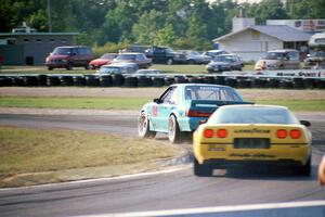 Boris Said III's Ford Saleen Mustang SC leads Kim Baker's Chevy Corvette