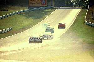 The leaders pass backmarkers on their way uphill to turn 6.