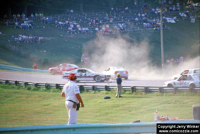 Chris Neville's Chevy Camaro is backwards after being hit between turns 5 and 6 on lap one.