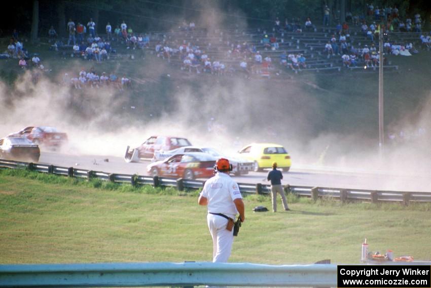 Chris Neville's Chevy Camaro is backwards after being hit between turns 5 and 6 on lap one.