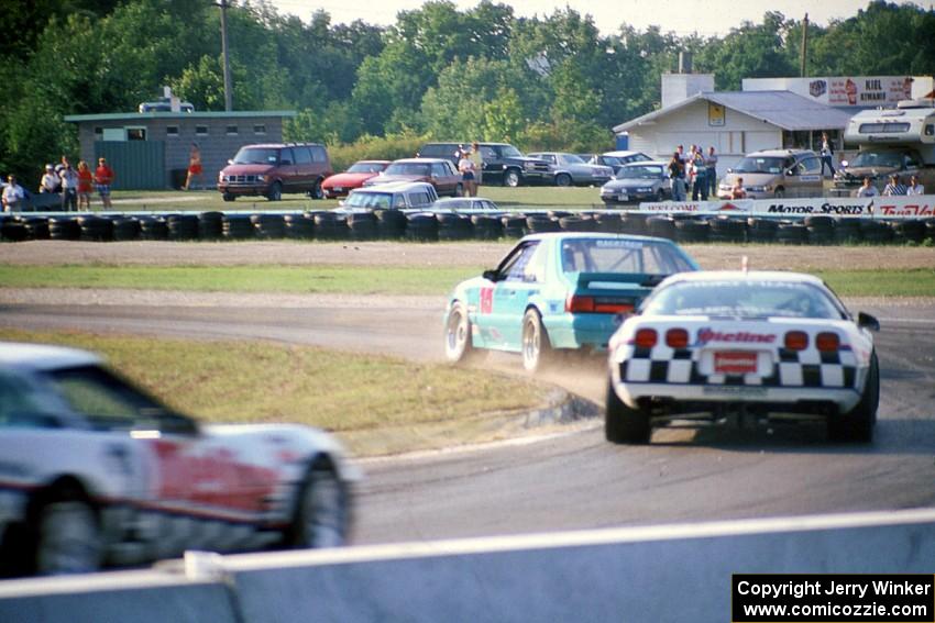 Boris Said III's Ford Saleen Mustang SC followed by Bill Cooper's and R.K. Smith's Chevy Corvettes