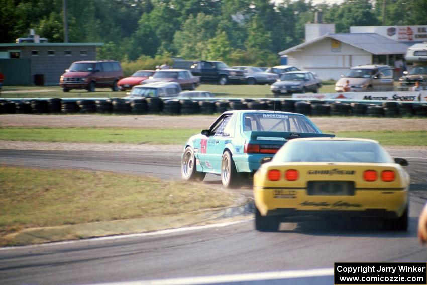 Boris Said III's Ford Saleen Mustang SC leads Kim Baker's Chevy Corvette