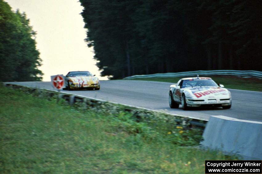 Bill Cooper's Chevy Corvette ahead of Jim Minneker's Chevy Corvette