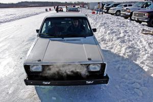 Brad Johnson pulls his VW Rabbit into the pits after a sprint race.