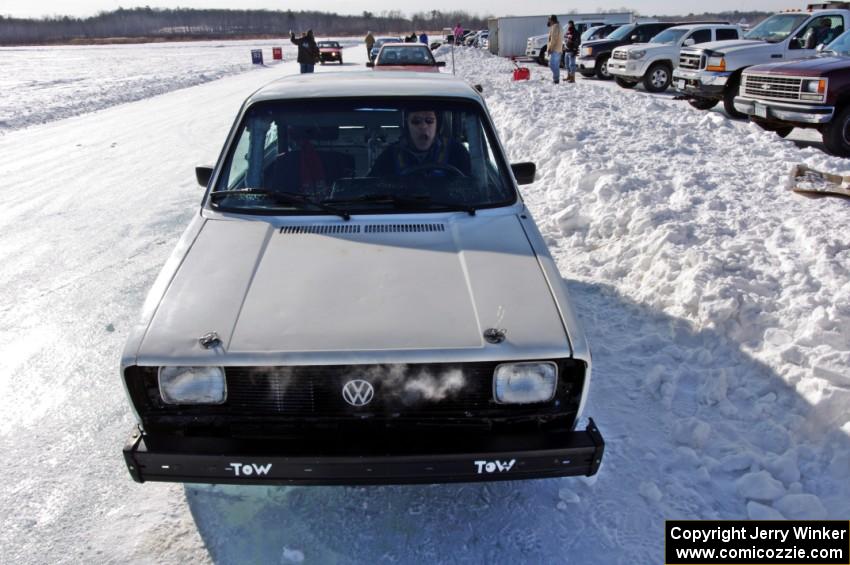 Brad Johnson pulls his VW Rabbit into the pits after a sprint race.