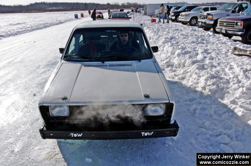 Brad Johnson pulls his VW Rabbit into the pits after a sprint race.