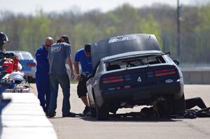 Generations Nissan 300ZX in the pits early on.