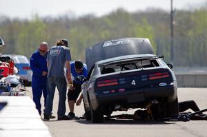 Generations Nissan 300ZX in the pits early on.