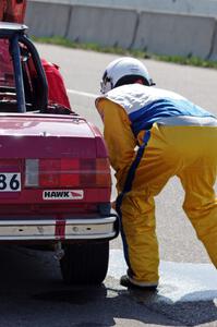 Missing Link Motorsports BMW 325i in the pits during a driver's change.