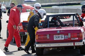 Missing Link Motorsports BMW 325i in the pits during a driver's change.