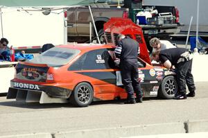 Holy Rollers Honda Civic in the pits for an extended stop.