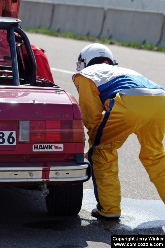 Missing Link Motorsports BMW 325i in the pits during a driver's change.