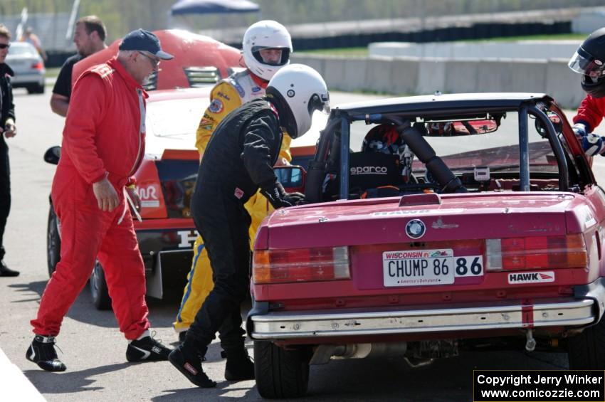 Missing Link Motorsports BMW 325i in the pits during a driver's change.