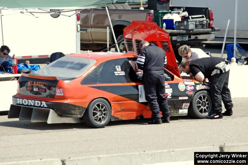 Holy Rollers Honda Civic in the pits for an extended stop.